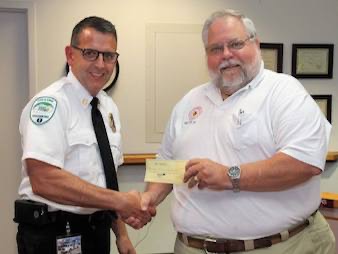 ed presents check to chief reduced.jpg
