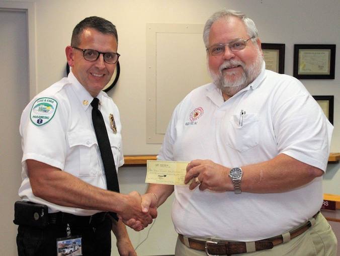 ed presents check to chief.jpg