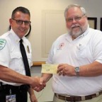 ed presents check to chief reduced.jpg